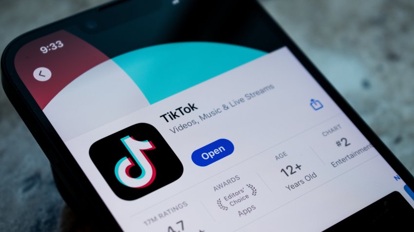 SALT LAKE CITY, UTAH, USA – JULY 12, 2024: Man holds smart phone with TikTok application on the screen. TikTok is a video-sharing app for smartphones.